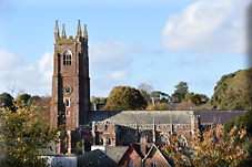 Powderham to Kenton: A Journey through War, Worship, and Empire
